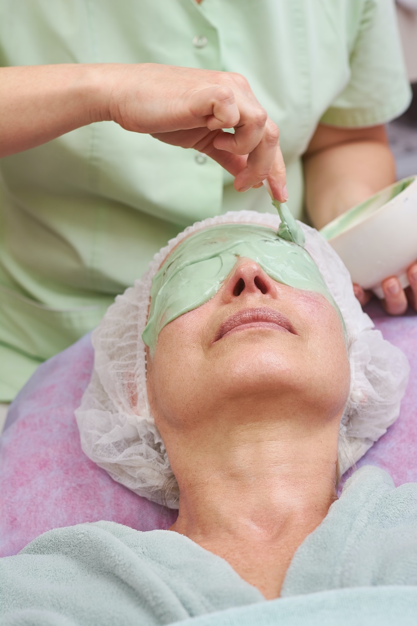 Mature woman, alginate face mask